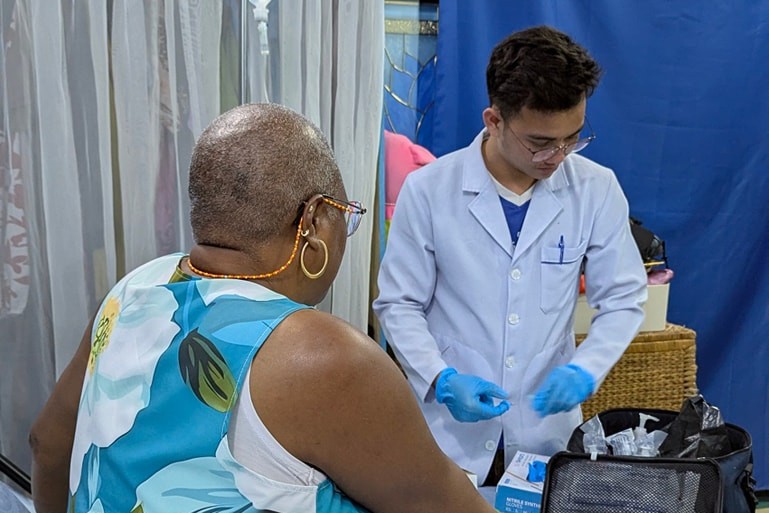 CamboCare doctor assisting a patient